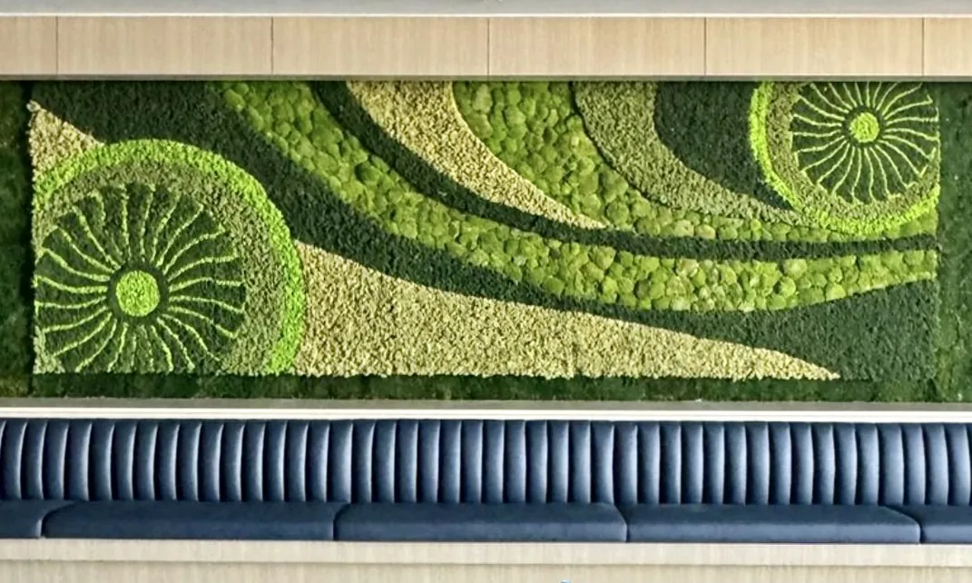 Moss feature wall above a banquette