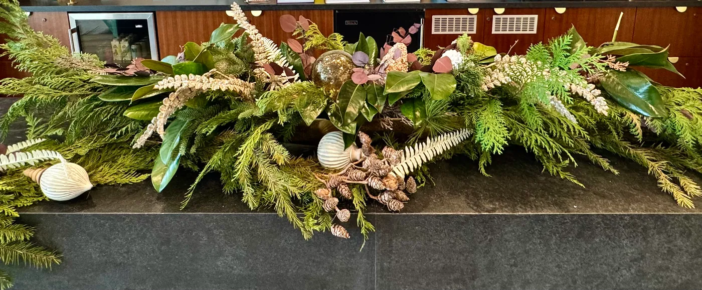 A holiday garland along a ledge